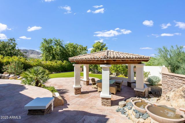 a view of a balcony with mountain view and a floor to ceiling window