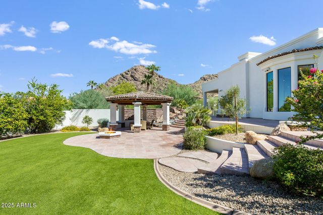 a bedroom with a bed and a fireplace
