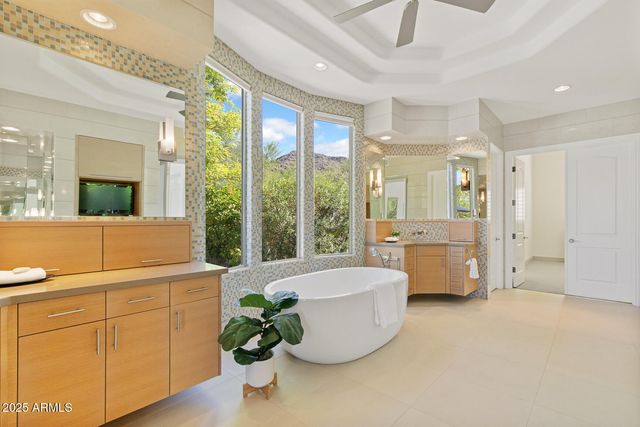 a lobby with furniture and floor to ceiling window