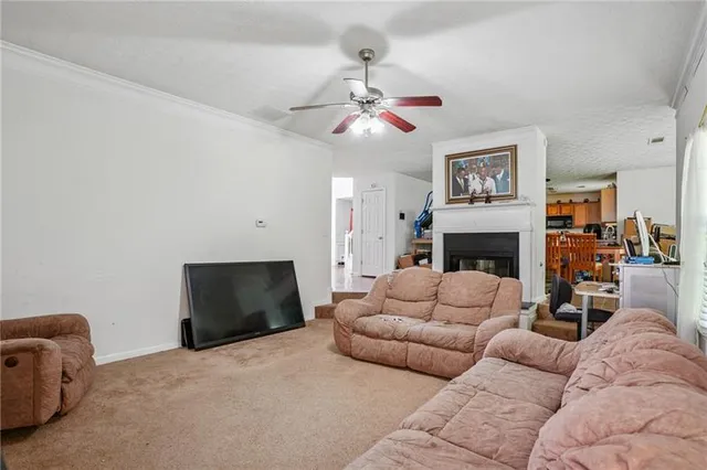a living room with furniture a fireplace