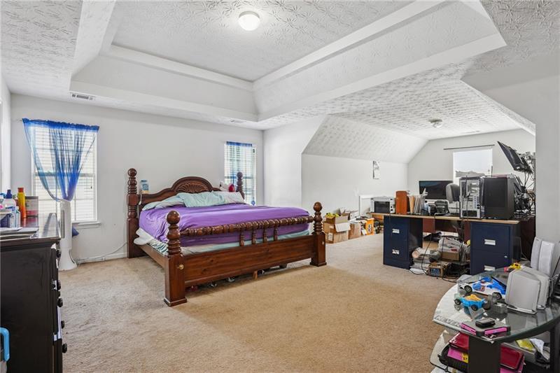 345 Timberlake Terrace Covington, GA 30016 - Photo 6 of 10 a bedroom with furniture and a chair