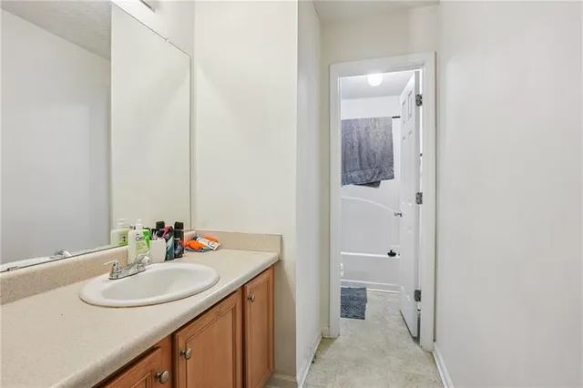 a bathroom with a sink and a mirror