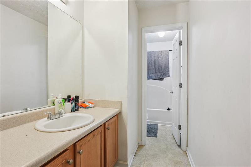 345 Timberlake Terrace Covington, GA 30016 - Photo 9 of 10 a bathroom with a sink and a mirror