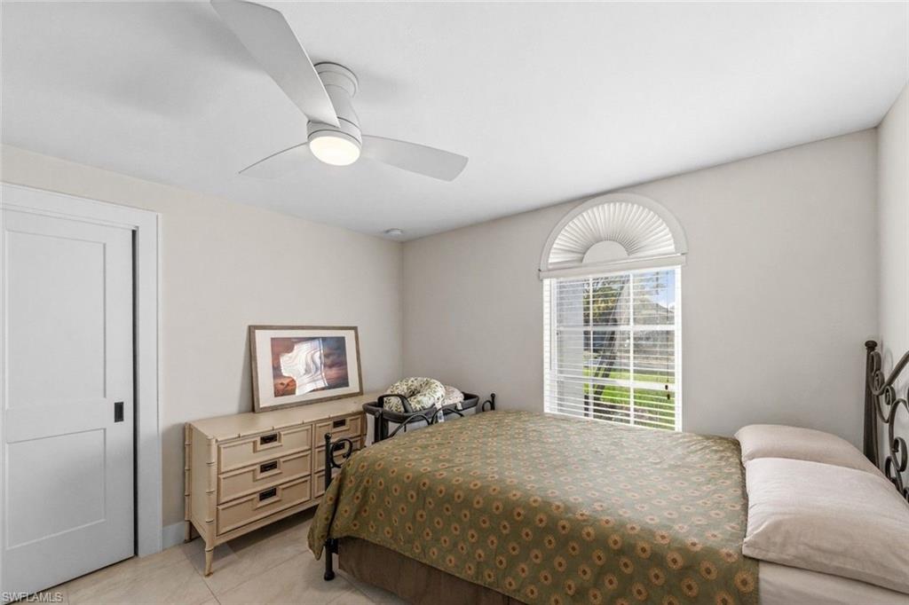 4724 Riverside Drive Estero, FL 33928 - Photo 25 of 44 a bedroom with a bed and a window