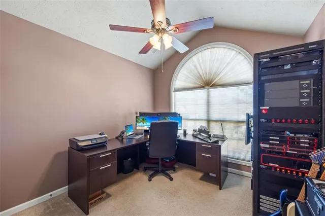 a room with furniture and a large window