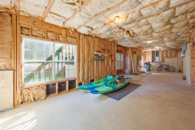 a living room filled with furniture and a garage