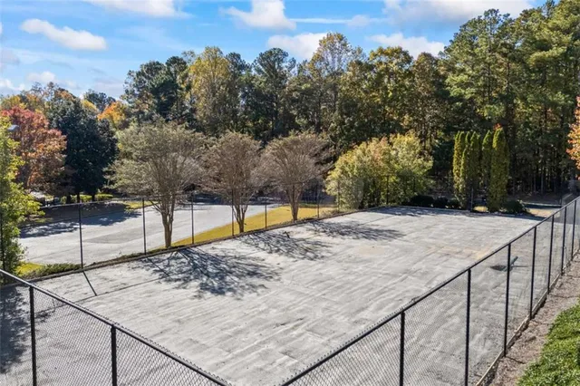 a view of a backyard and trees