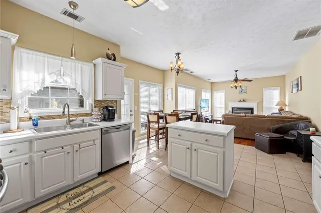a kitchen with a sink and cabinets