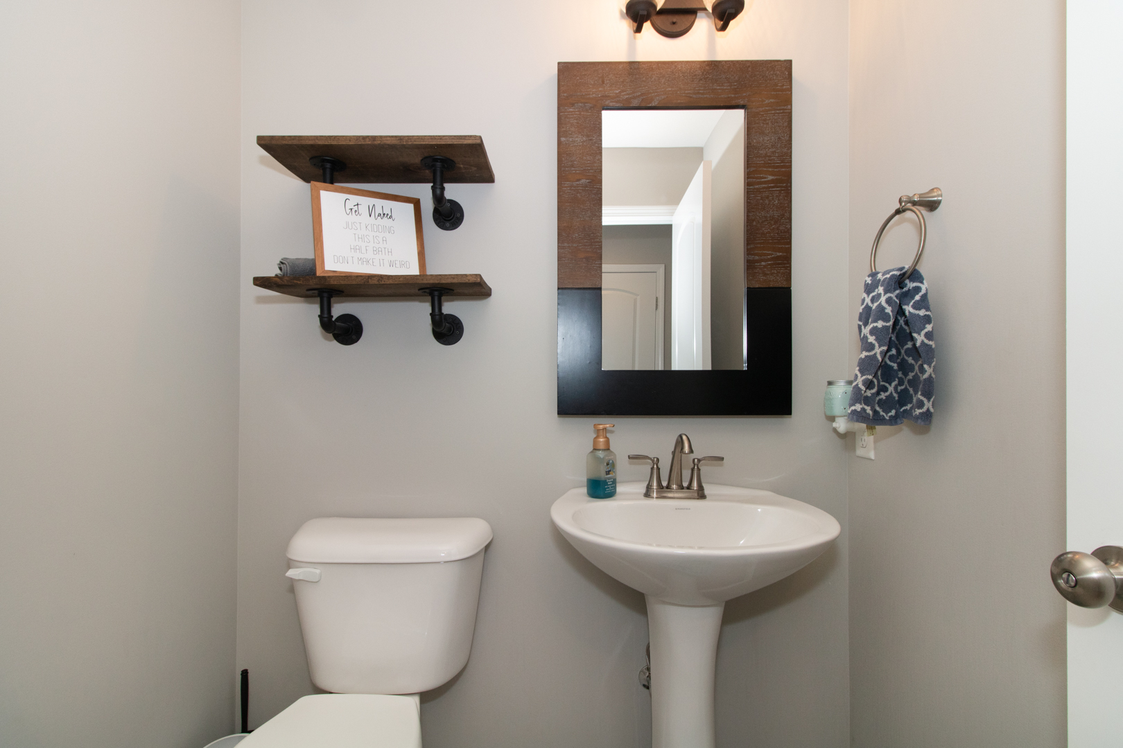 1767 Beech Street Normal, IL 61761 - Photo 9 of 55 a bathroom with a toilet sink and mirror