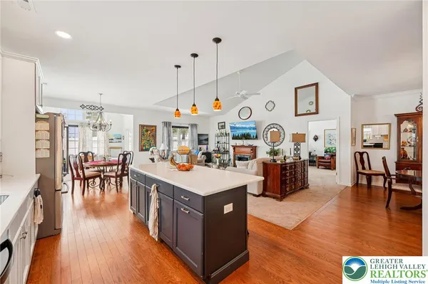 a very nice looking living room with dining room and wooden floor