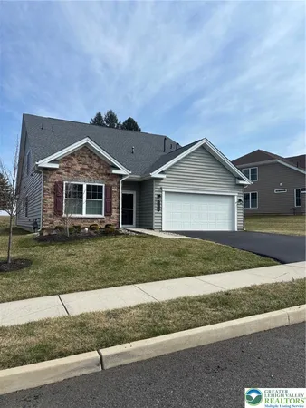 front view of a house and a yard