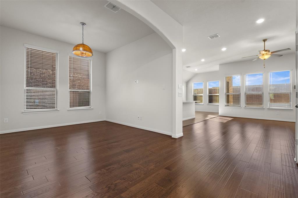 1740 Rio Costilla Road Fort Worth, TX 76131 - Photo 6 of 40 Wood-finish flooring throughout, with a decorative pendant light fixture and recessed ceiling lighting