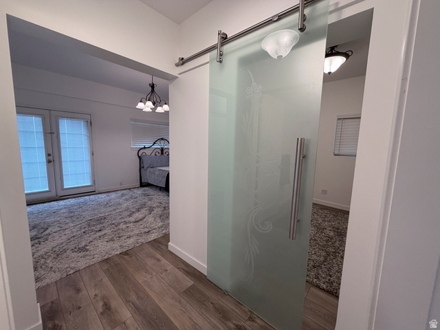 2855 South 1000 West Perry, UT 84302 - Photo 116 of 142 Ensuite bathroom with dark wood-type flooring, a walk in shower, and suspended lighting