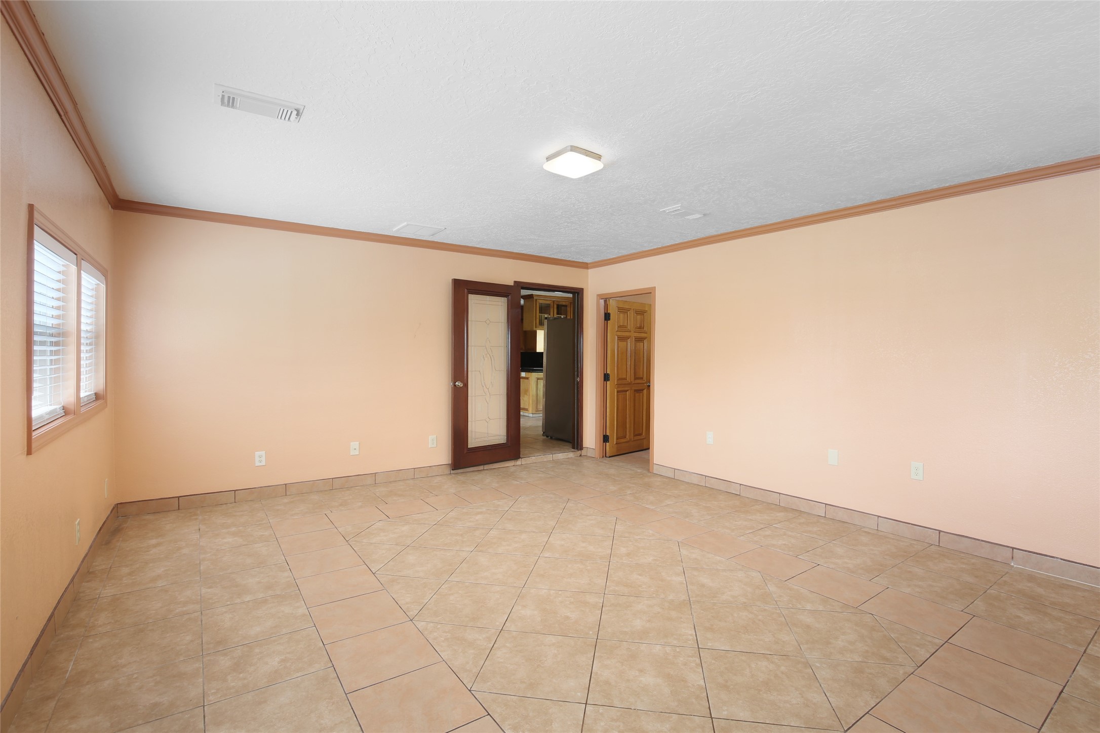6923 Leader Street Houston, TX 77074 - Photo 16 of 19 a view of an empty room with a window