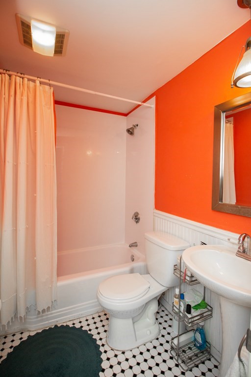 34 Winchester Street, Unit 2 Brookline, MA 02446 - Photo 12 of 14 a bathroom with a toilet a sink and a shower