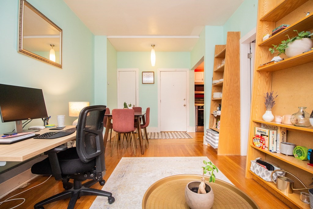 34 Winchester Street, Unit 2 Brookline, MA 02446 - Photo 2 of 14 a view of a workspace with furniture and a kitchen