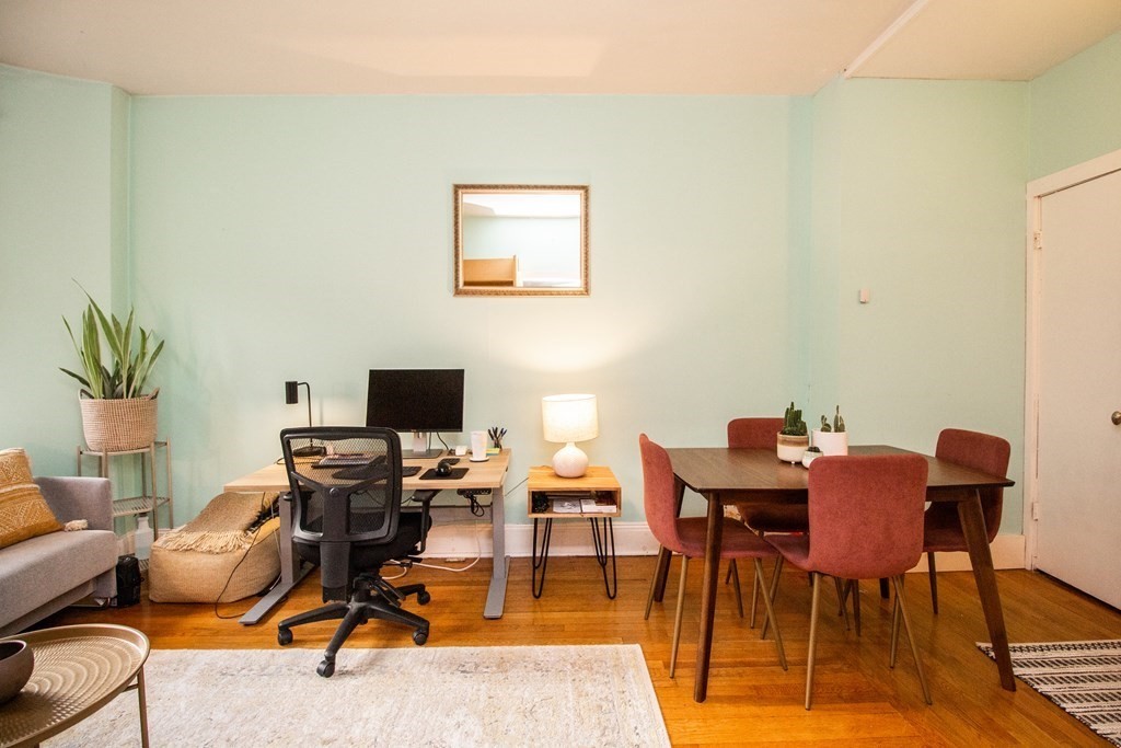 34 Winchester Street, Unit 2 Brookline, MA 02446 - Photo 3 of 14 a workspace with furniture and wooden floor