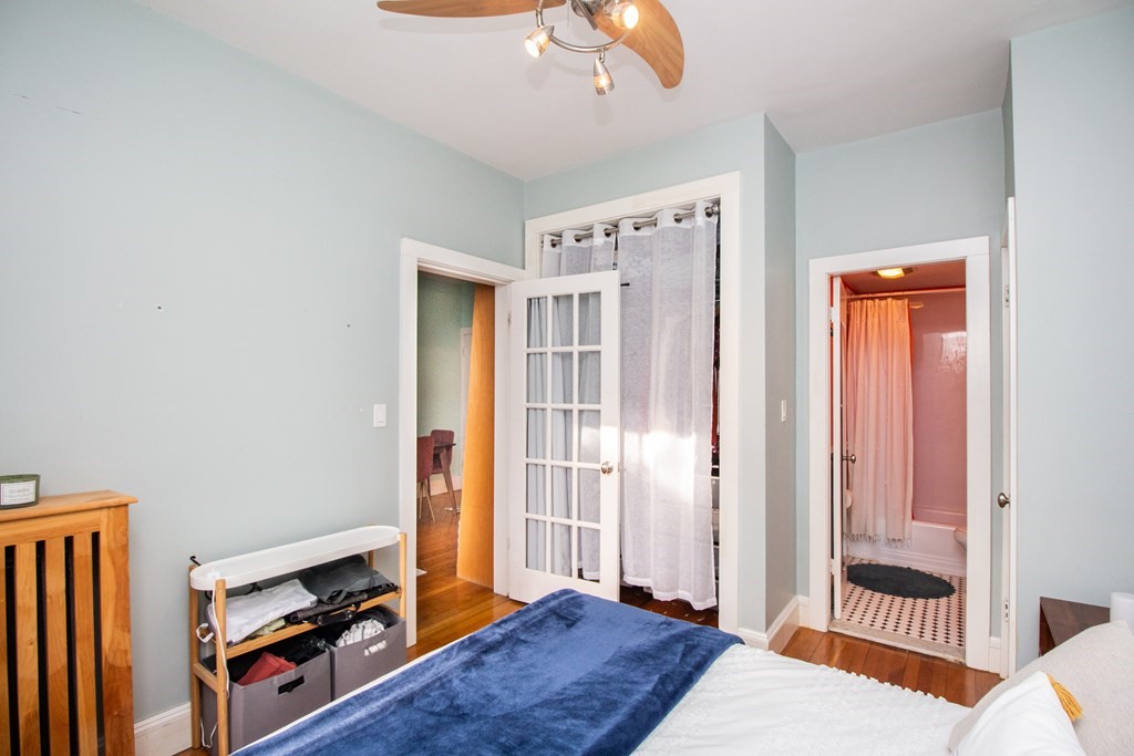 34 Winchester Street, Unit 2 Brookline, MA 02446 - Photo 9 of 14 a bedroom with a bed and a window