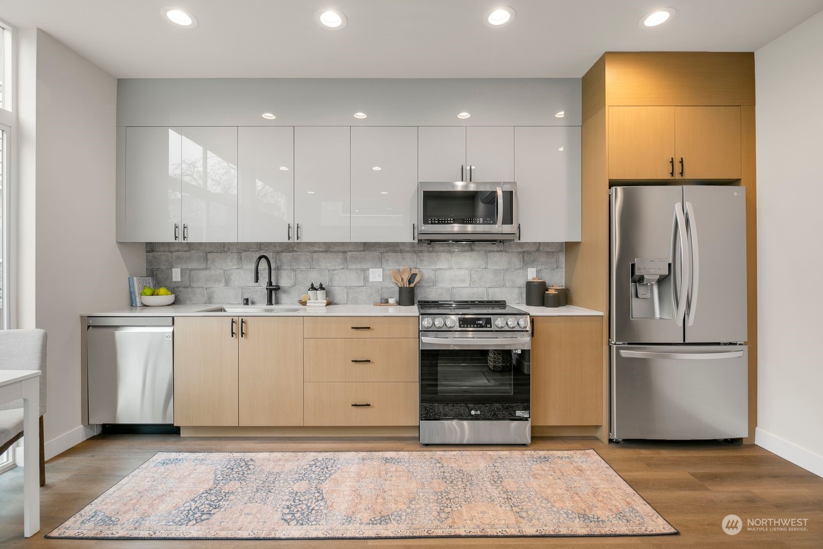 1605 South Washington Street Seattle, WA 98144 - Photo 4 of 17 a kitchen with a refrigerator sink and white cabinets