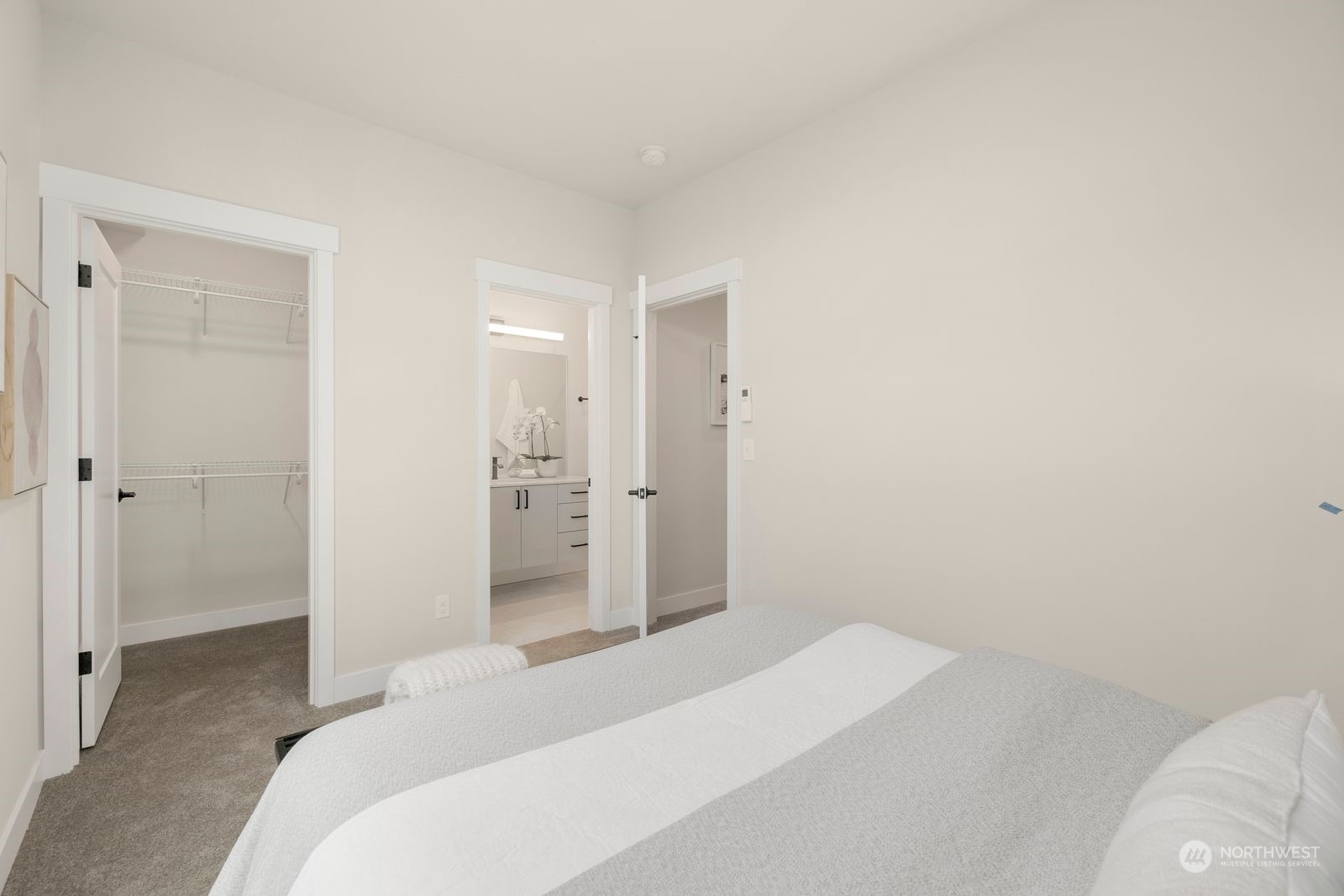 1605 South Washington Street Seattle, WA 98144 - Photo 7 of 17 a bedroom with a bed and a bathroom