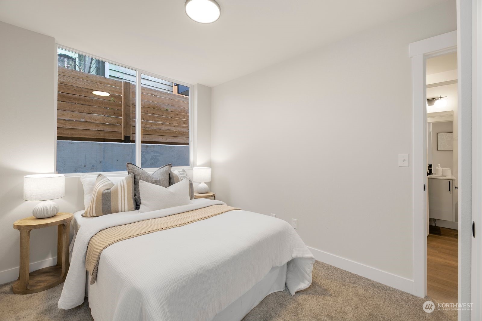 1605 South Washington Street Seattle, WA 98144 - Photo 9 of 17 a bedroom with a bed and a window