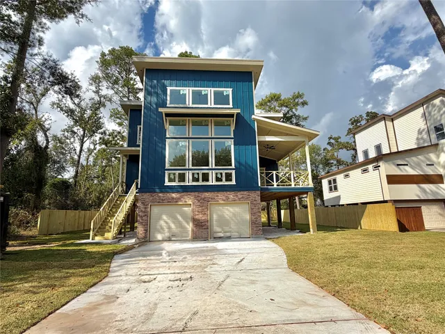 a view of an entryway and livingroom with wooden floor