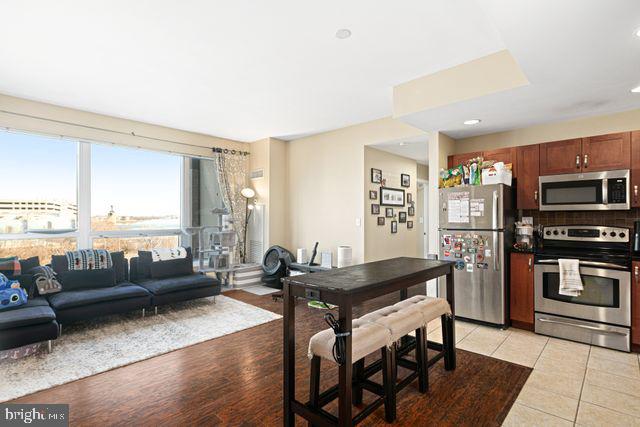 901 North Penn Street, Unit R507 Philadelphia, PA 19123 - Photo 2 of 28 a living room with furniture and a window