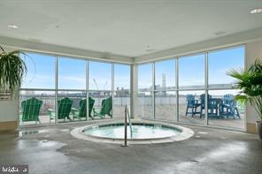 901 North Penn Street, Unit R507 Philadelphia, PA 19123 - Photo 27 of 28 a swimming pool with lawn chairs and plants