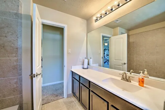 a bathroom with a sink double vanity and a mirror