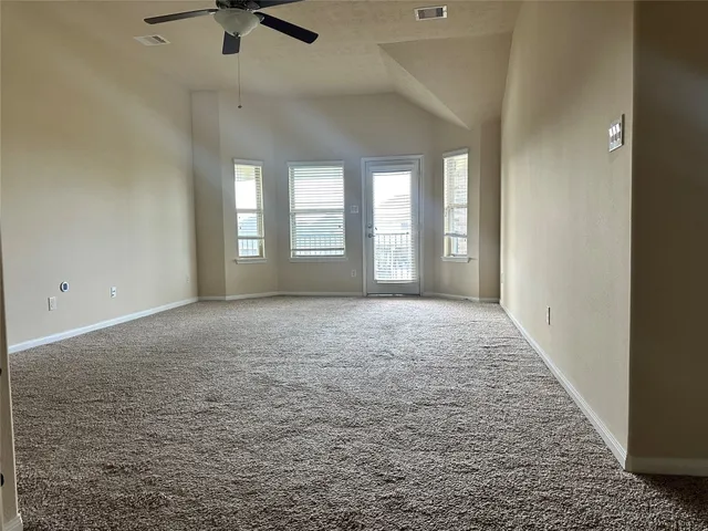 a view of hallway with windows