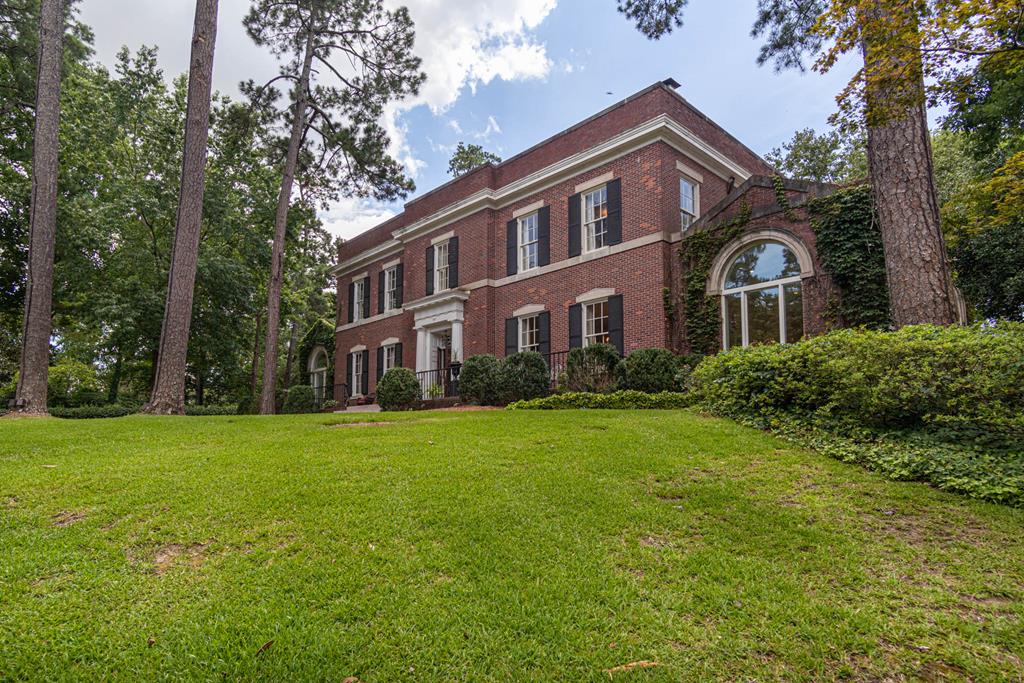 1617 Summit Drive Columbus, GA 31906 - Photo 1 of 35 a front view of a house with a garden