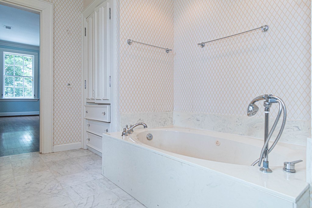 1617 Summit Drive Columbus, GA 31906 - Photo 19 of 35 a white bath tub sitting next to a shower