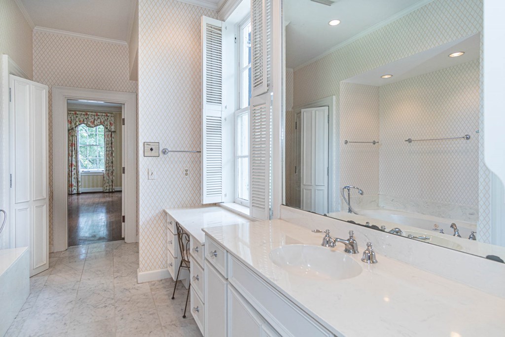 1617 Summit Drive Columbus, GA 31906 - Photo 20 of 35 a spacious bathroom with a double vanity sink shower and a mirror