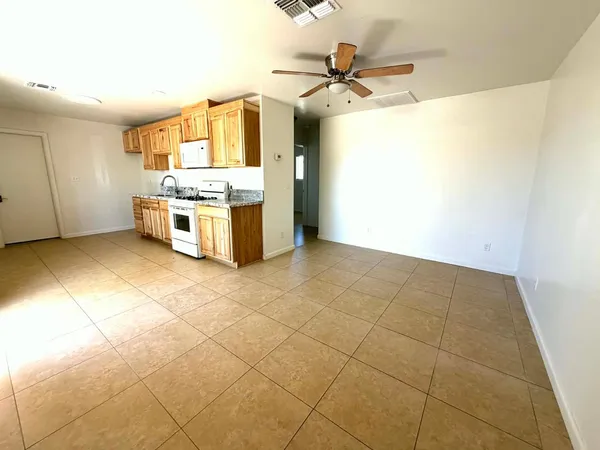 a view of a kitchen with a sink and a stove top oven