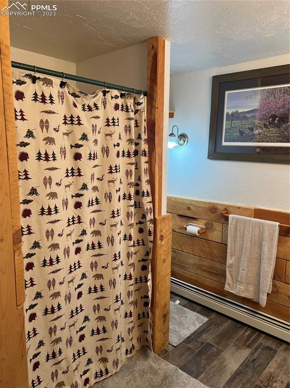 87 Thompson Road Gardner, CO 81040 - Photo 49 of 49 a bathroom with a shower curtain