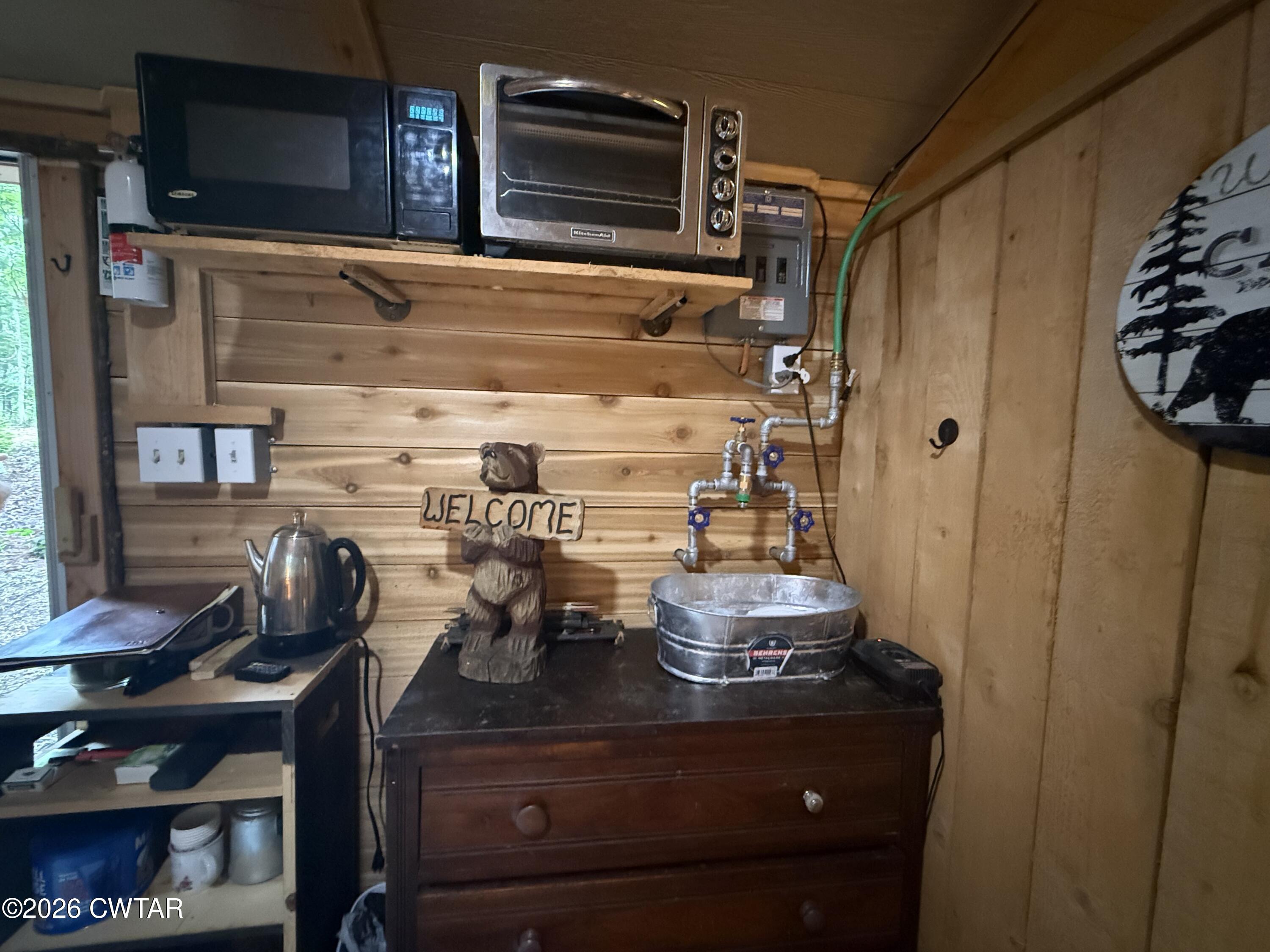 1782 Smith Chapel Road Decaturville, TN 38329 - Photo 6 of 22 a kitchen with a stove and a microwave