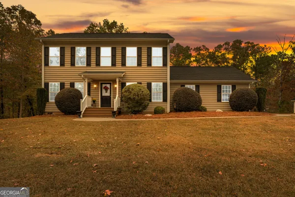 front view of a house with a yard