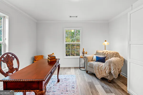 a bedroom with furniture and a window