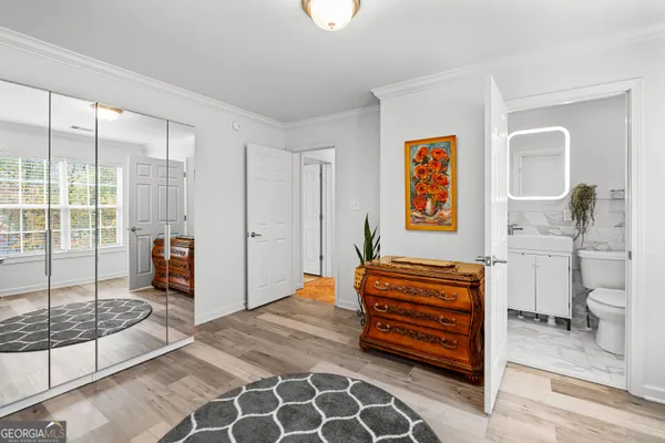 a bedroom with furniture and a window