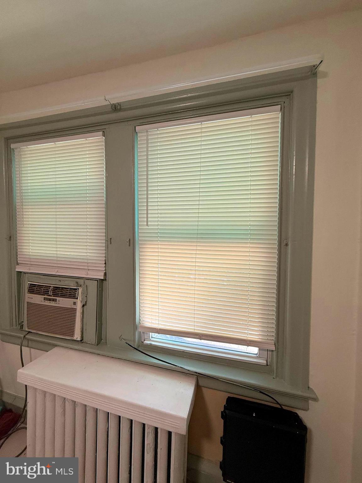 5118 Oakland Street, Unit 2 Philadelphia, PA 19124 - Photo 21 of 36 a view of a kitchen that shows a sink window and a refrigerator