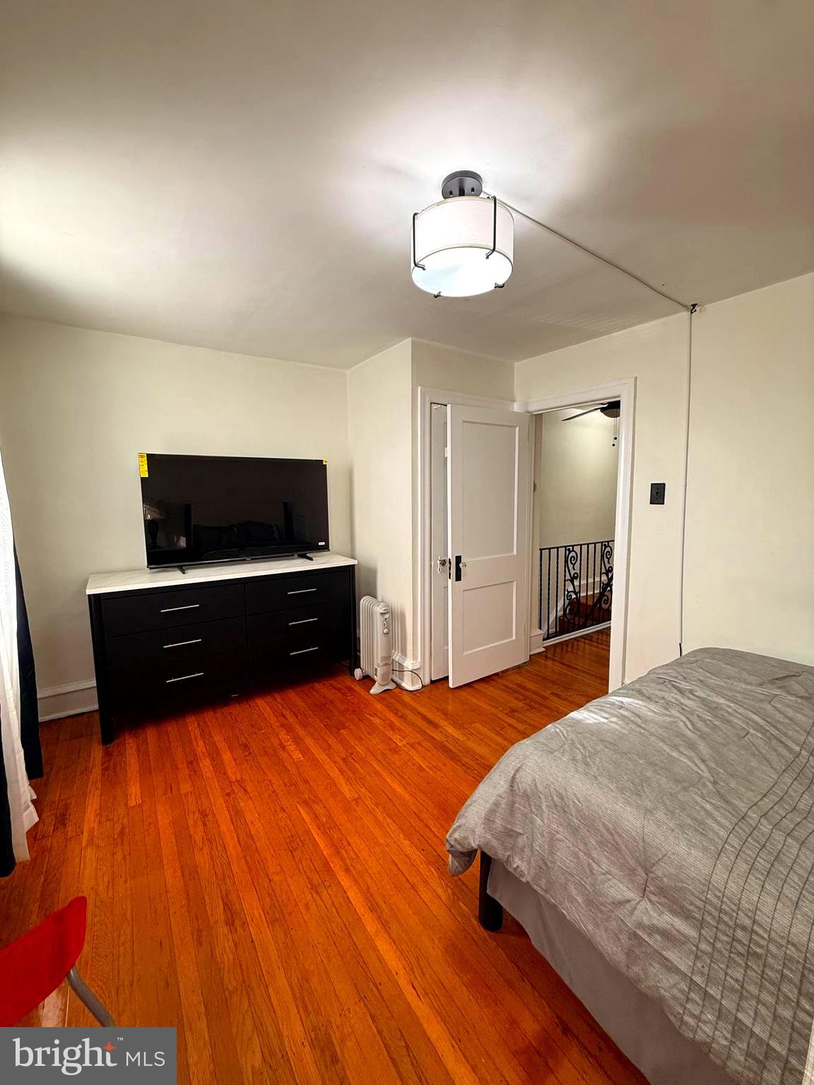 5118 Oakland Street, Unit 2 Philadelphia, PA 19124 - Photo 28 of 36 a bedroom with a bed and a flat screen tv