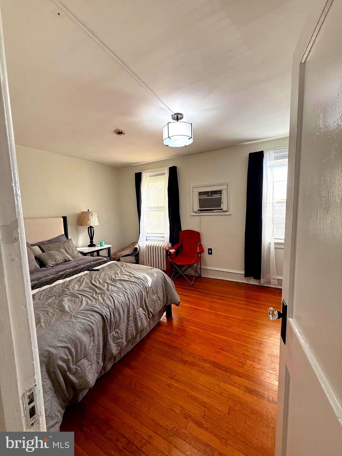 5118 Oakland Street, Unit 2 Philadelphia, PA 19124 - Photo 30 of 36 a bedroom with double bed and a closet