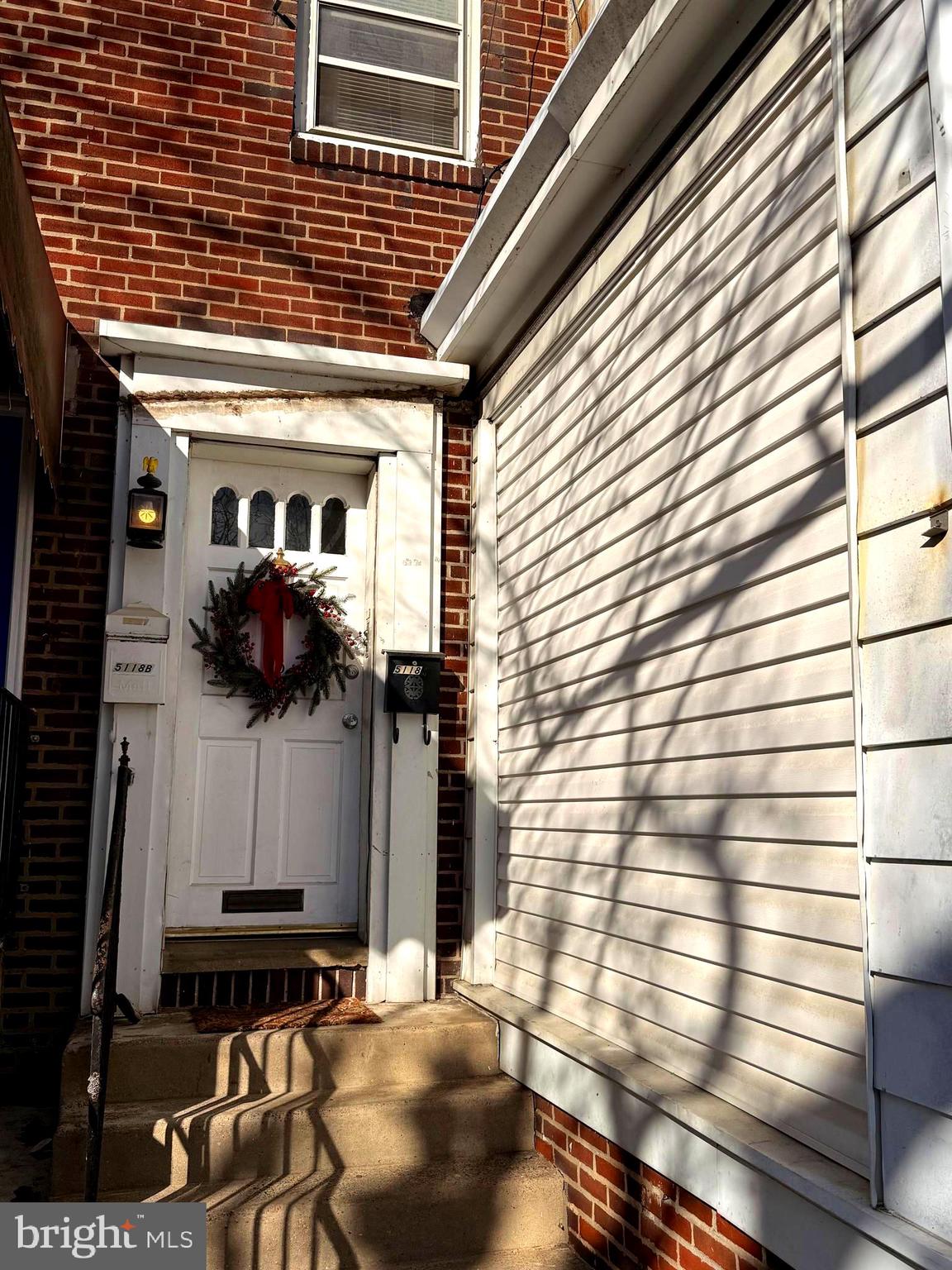 5118 Oakland Street, Unit 2 Philadelphia, PA 19124 - Photo 5 of 36 a front view of a house with a garage