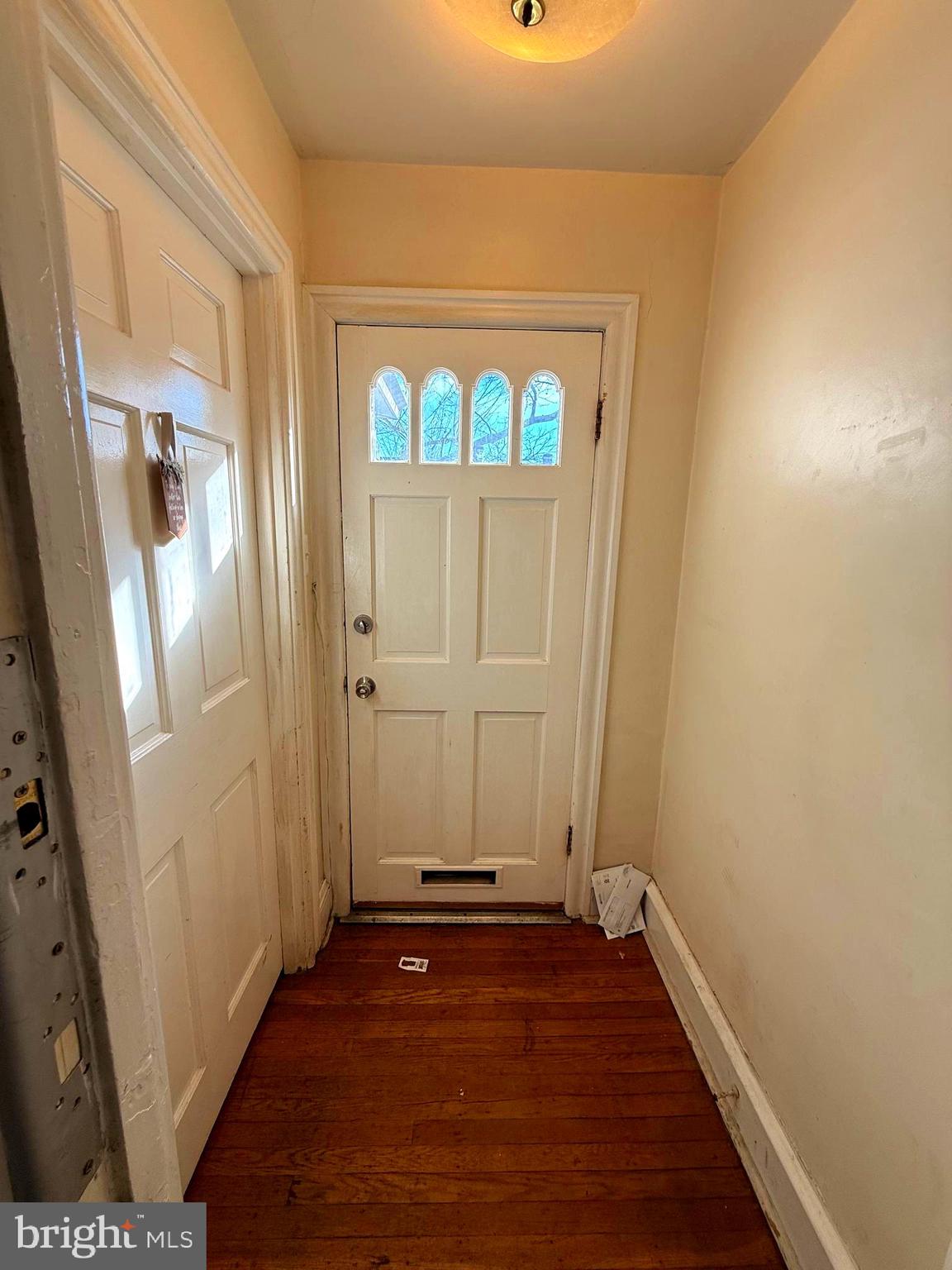 5118 Oakland Street, Unit 2 Philadelphia, PA 19124 - Photo 6 of 36 an empty room with wooden floor and windows