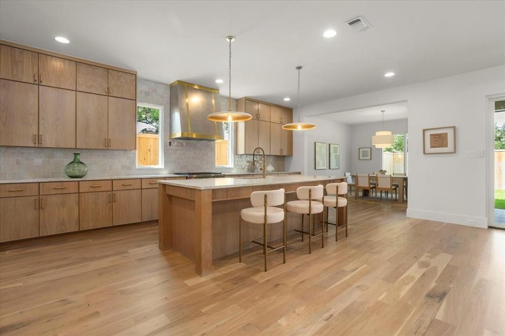 3935 Rochelle Drive Dallas, TX 75220 - Photo 11 of 27 a kitchen with a sink cabinets and wooden floor