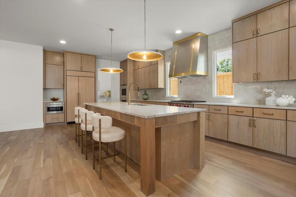 3935 Rochelle Drive Dallas, TX 75220 - Photo 12 of 27 a kitchen with a sink cabinets and wooden floor