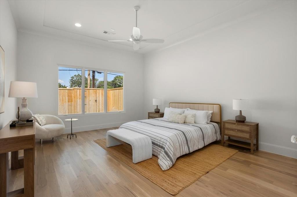 3935 Rochelle Drive Dallas, TX 75220 - Photo 15 of 27 a bedroom with a bed and wooden floor