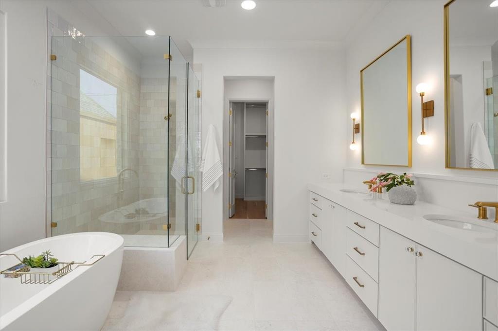 3935 Rochelle Drive Dallas, TX 75220 - Photo 16 of 27 a spacious bathroom with a double vanity sink a large mirror and shower