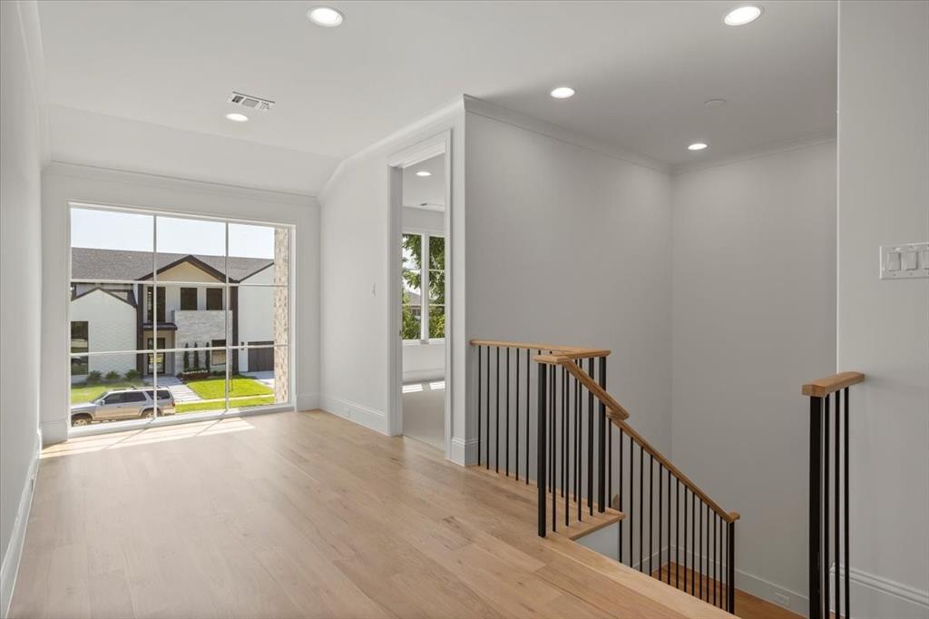 3935 Rochelle Drive Dallas, TX 75220 - Photo 19 of 27 a view of a hallway with a chandelier