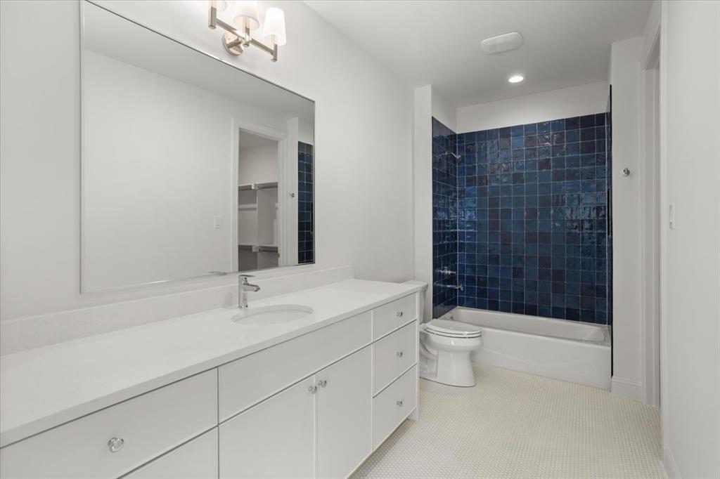 3935 Rochelle Drive Dallas, TX 75220 - Photo 21 of 27 a bathroom with a double vanity sink toilet and shower
